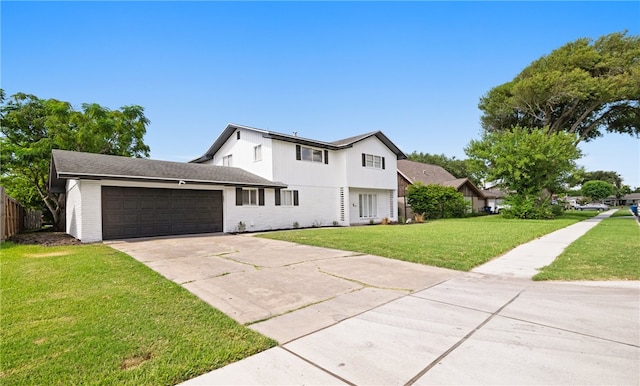 view of front of house featuring a garage and a front lawn