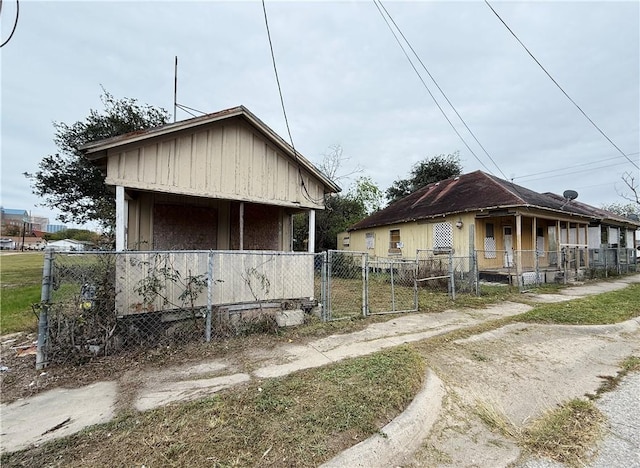 view of side of home with covered porch