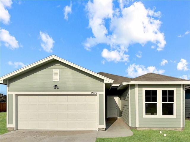 single story home featuring a garage