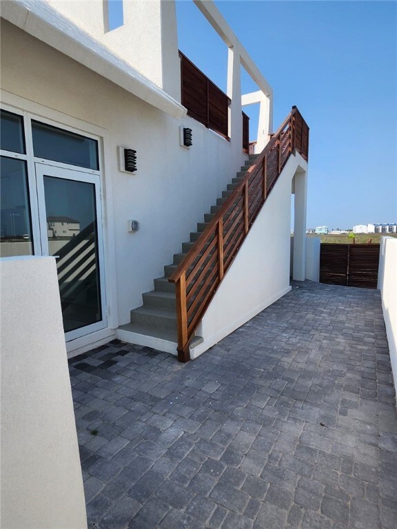 exterior space with fence and stairs