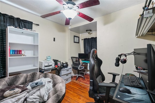 office featuring hardwood / wood-style flooring and ceiling fan