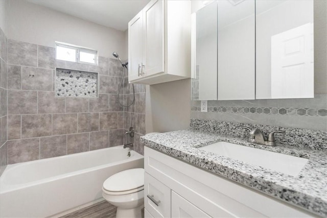 1337 Daytona Dr, Corpus Christi, TX 78415 - full bath featuring tub / shower combination, toilet, vanity, and tasteful backsplash