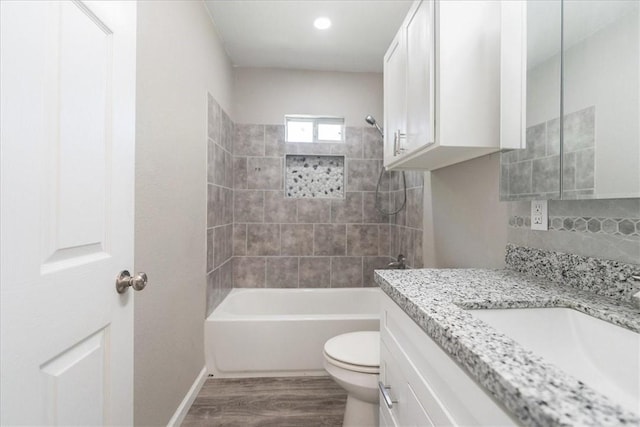 1337 Daytona Dr, Corpus Christi, TX 78415 - bathroom featuring toilet, wood finished floors, vanity, shower / washtub combination, and backsplash