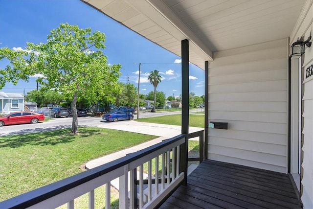 1337 Daytona Dr, Corpus Christi, TX 78415 - wooden deck with a yard and covered porch