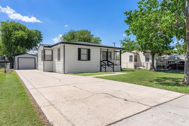 1337 Daytona Dr, Corpus Christi, TX 78415 - manufactured / mobile home featuring concrete driveway, an outbuilding, and a garage