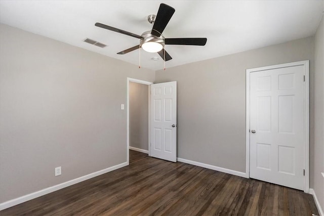 1337 Daytona Dr, Corpus Christi, TX 78415 - unfurnished bedroom featuring dark wood-style floors, baseboards, and ceiling fan