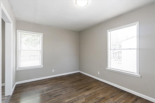 1337 Daytona Dr, Corpus Christi, TX 78415 - empty room featuring dark wood finished floors and baseboards