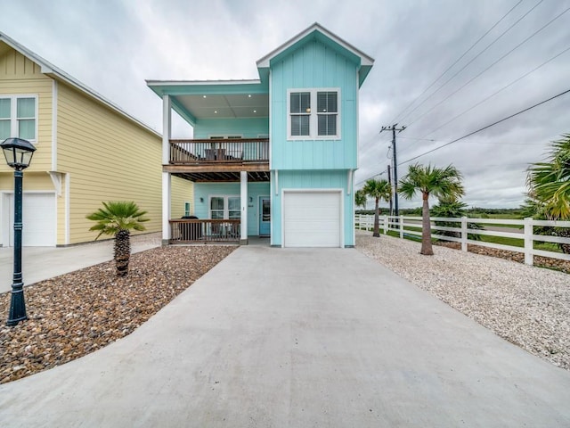 view of front facade featuring a garage and a balcony