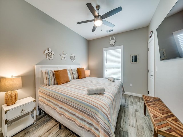 bedroom featuring ceiling fan and hardwood / wood-style flooring