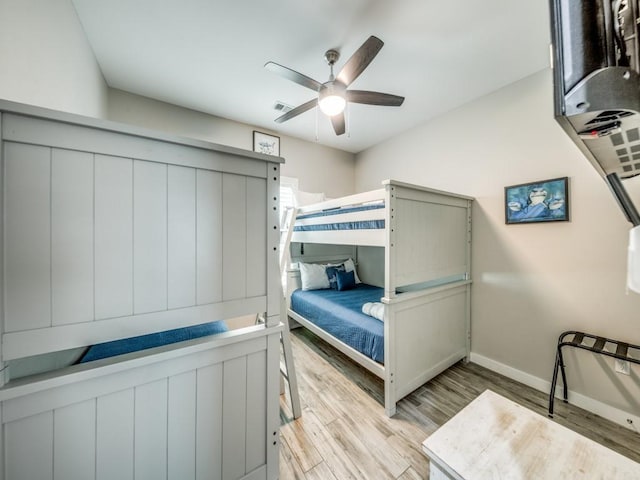 bedroom featuring ceiling fan and light hardwood / wood-style flooring