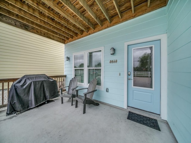 entrance to property featuring covered porch