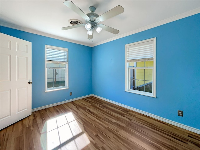 unfurnished room with ceiling fan, hardwood / wood-style floors, and ornamental molding