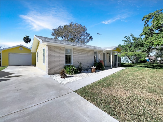 ranch-style home with a garage and a front yard