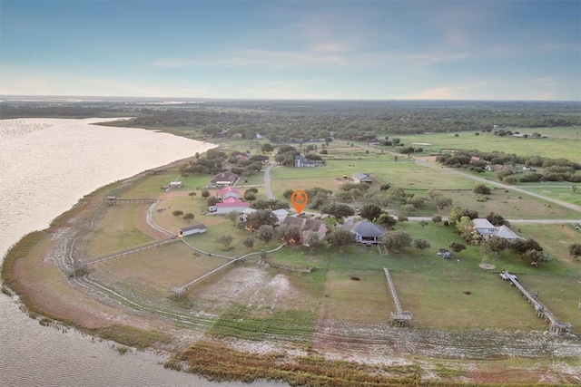 bird's eye view with a water view and a rural view