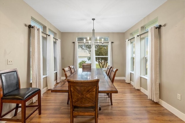 24475 La Ponderosa Dr, Mathis, TX 78368 - dining space with a chandelier and wood finished floors