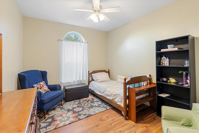 bedroom featuring light hardwood / wood-style floors and ceiling fan