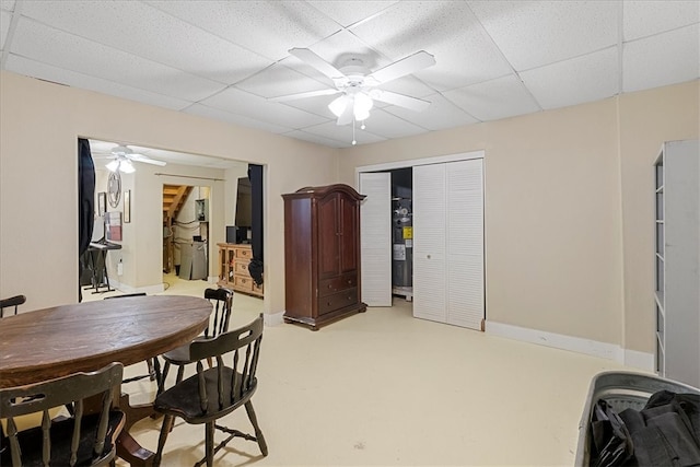 dining room featuring a drop ceiling and ceiling fan