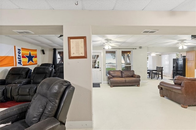 living room with a paneled ceiling