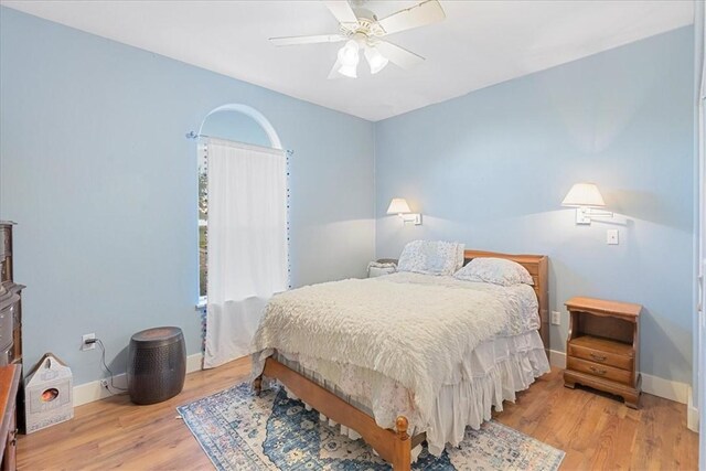24475 La Ponderosa Dr, Mathis, TX 78368 - bedroom with wood finished floors and a ceiling fan
