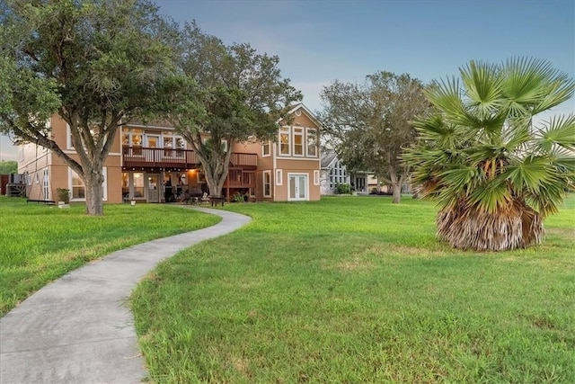 24475 La Ponderosa Dr, Mathis, TX 78368 - view of grassy yard with a wooden deck