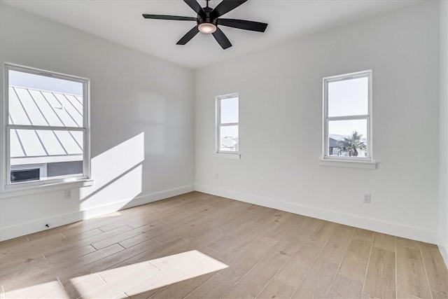 unfurnished room with ceiling fan and light wood-type flooring