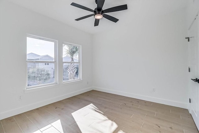 empty room featuring light hardwood / wood-style flooring and ceiling fan