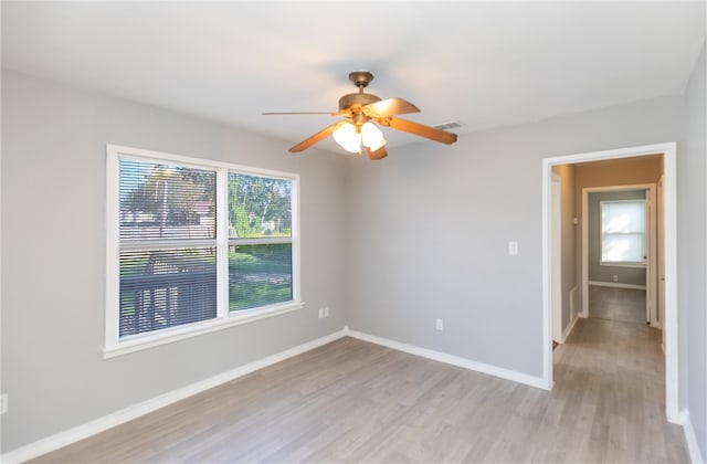 spare room with light hardwood / wood-style floors and ceiling fan