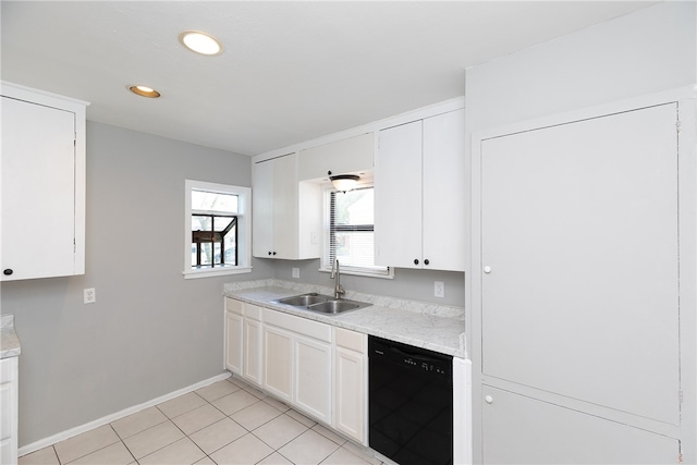 kitchen with black dishwasher, white cabinetry, sink, and light tile patterned floors