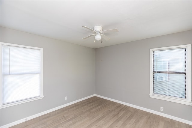 empty room with light hardwood / wood-style flooring and ceiling fan