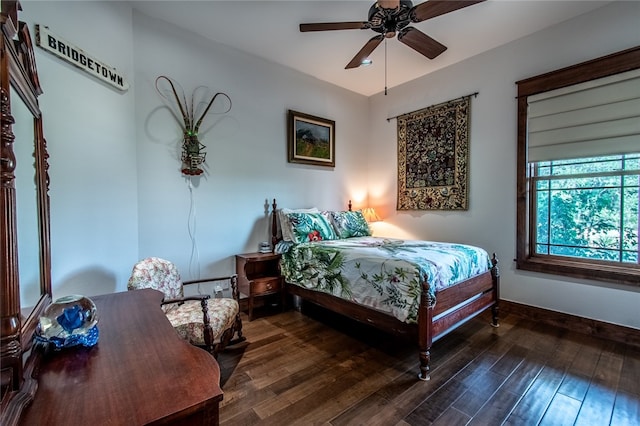 bedroom featuring dark hardwood / wood-style flooring and ceiling fan