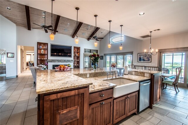 kitchen with a large island with sink, a healthy amount of sunlight, decorative light fixtures, wood ceiling, and dishwasher