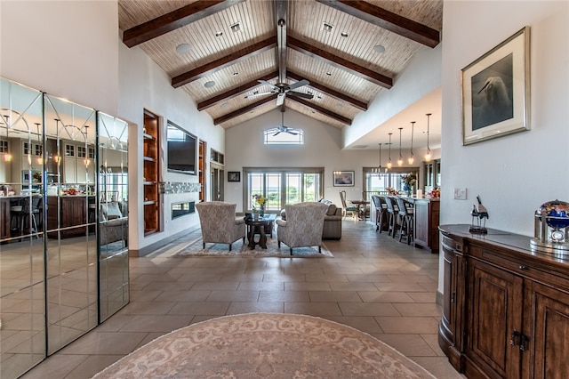 tiled living room with high vaulted ceiling, beamed ceiling, wooden ceiling, and ceiling fan