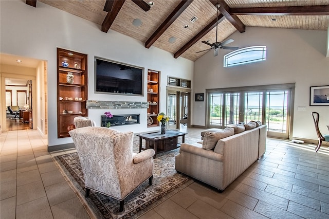 living room featuring high vaulted ceiling, beamed ceiling, ceiling fan, and wood ceiling