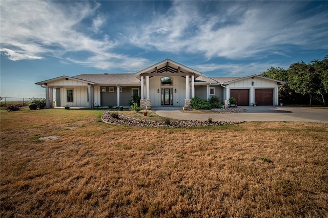 ranch-style house with a front lawn and a garage