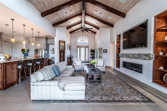 living room with wooden ceiling, beamed ceiling, built in shelves, and high vaulted ceiling