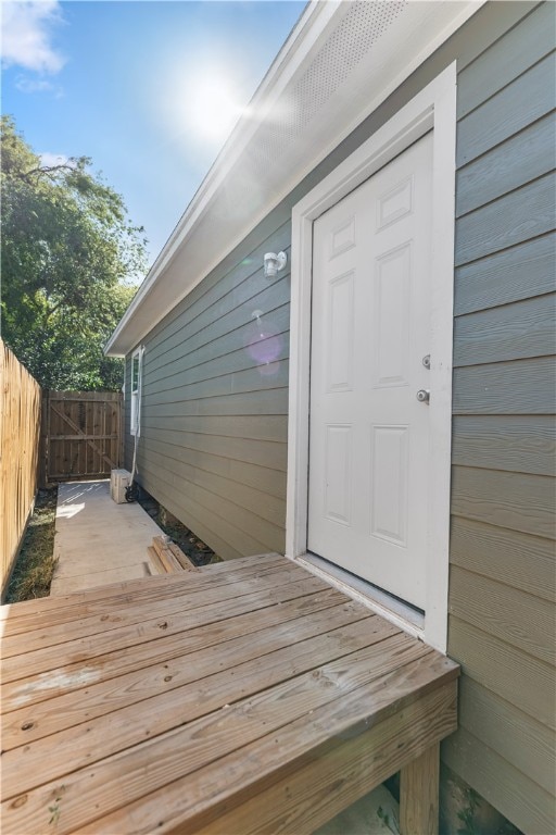 doorway to property featuring a wooden deck