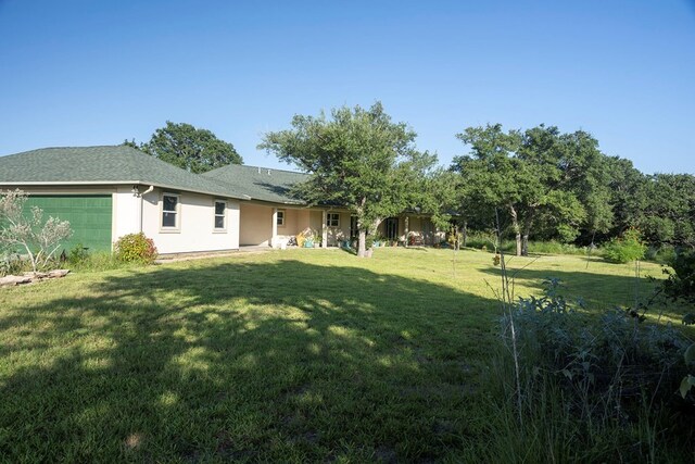 view of yard featuring a garage