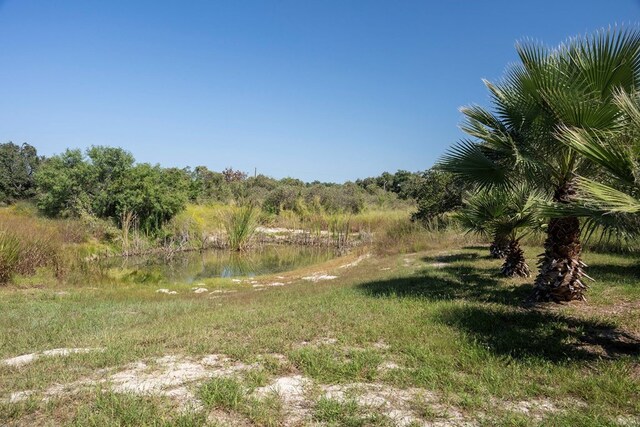 view of landscape with a water view