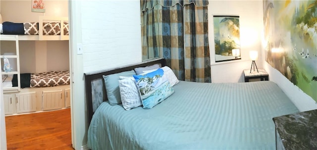 bedroom featuring wood-type flooring