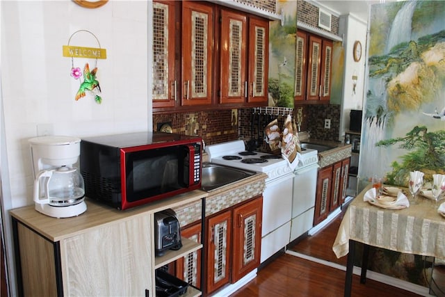 3938 Surfside Blvd Unit 1227, Corpus Christi, TX 78402 - kitchen featuring white electric range, tasteful backsplash, light countertops, and dark wood-style floors