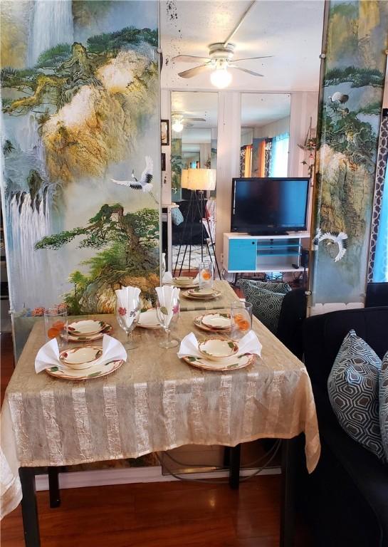 3938 Surfside Blvd Unit 1227, Corpus Christi, TX 78402 - dining space featuring wood finished floors and ceiling fan