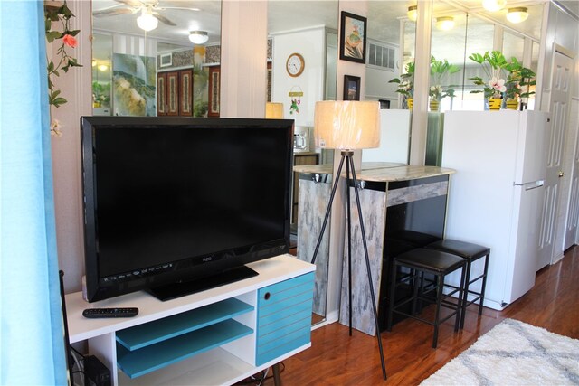 interior space featuring dark hardwood / wood-style flooring and ceiling fan