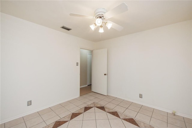5226 Honeysuckle, Corpus Christi, TX 78415 - spare room with light tile patterned floors, visible vents, baseboards, and a ceiling fan