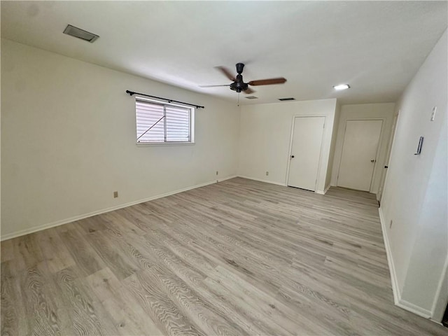 5226 Honeysuckle, Corpus Christi, TX 78415 - unfurnished bedroom with light wood-style flooring, baseboards, a ceiling fan, and visible vents
