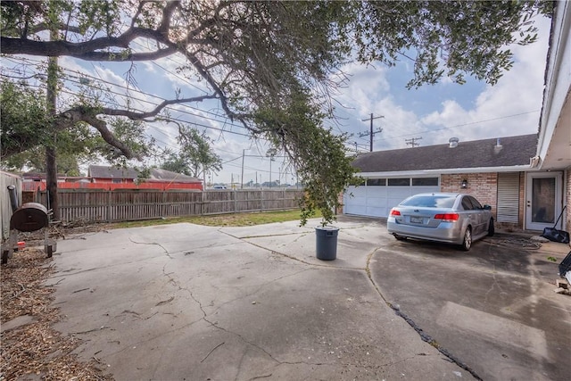 5226 Honeysuckle, Corpus Christi, TX 78415 - exterior space featuring driveway, fence, and a garage