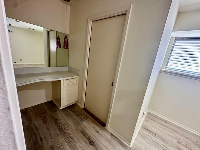 5226 Honeysuckle, Corpus Christi, TX 78415 - bathroom featuring baseboards, wood finished floors, and vanity
