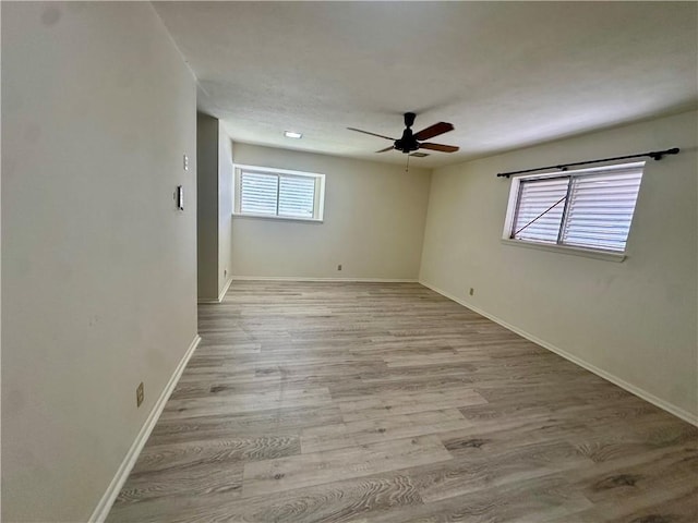 5226 Honeysuckle, Corpus Christi, TX 78415 - empty room featuring baseboards, ceiling fan, and wood finished floors