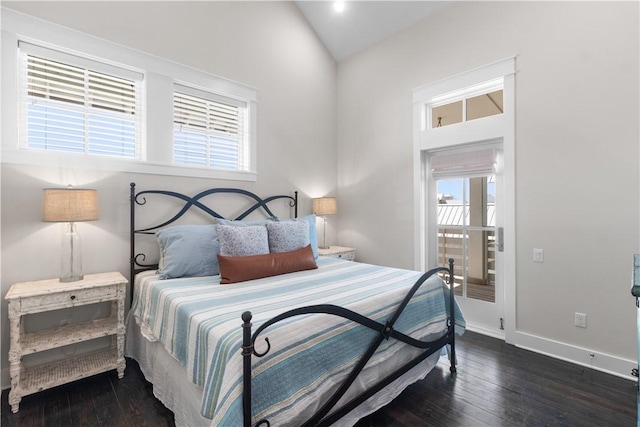 125 Fish Hook Ln, Port Aransas, TX 78373 - bedroom featuring vaulted ceiling, baseboards, and dark wood-style flooring