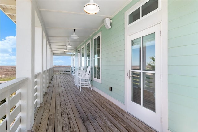 125 Fish Hook Ln, Port Aransas, TX 78373 - wooden terrace with a porch