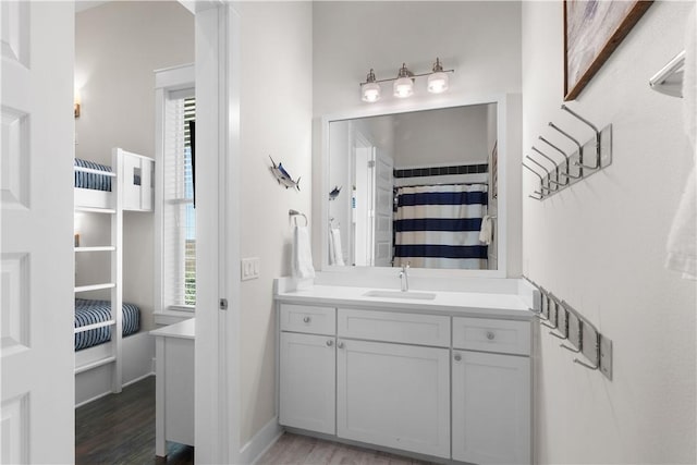 125 Fish Hook Ln, Port Aransas, TX 78373 - bathroom featuring wood finished floors, a wealth of natural light, and vanity
